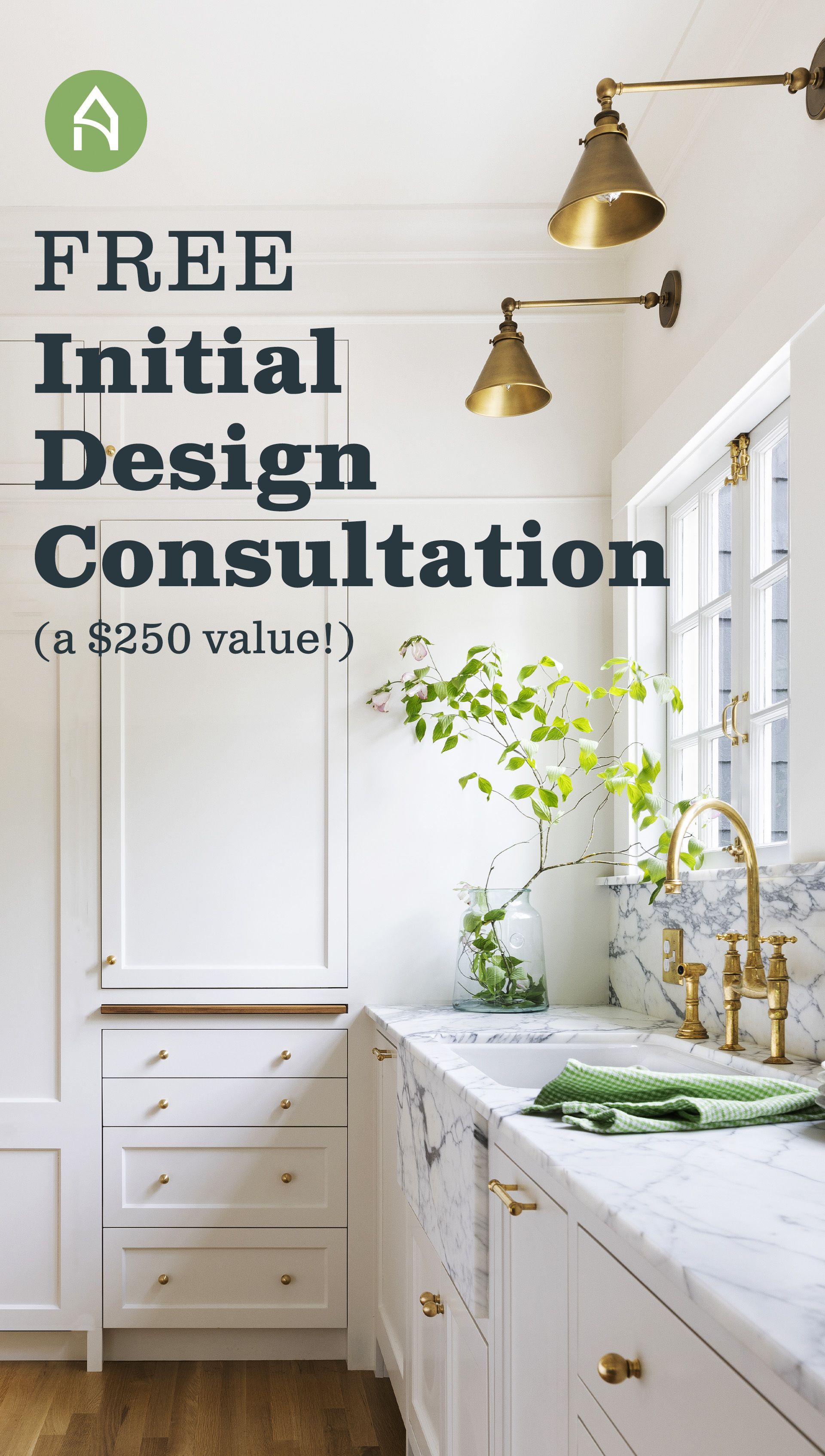 A kitchen with white cabinets and a sign that says `` free initial design consultation ''.