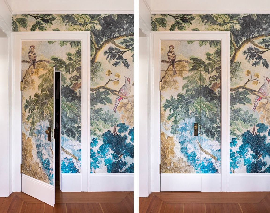 Anthropologie's Judarn mural brings lush nature into the primary bedroom, continuing across and disguising the closet door.