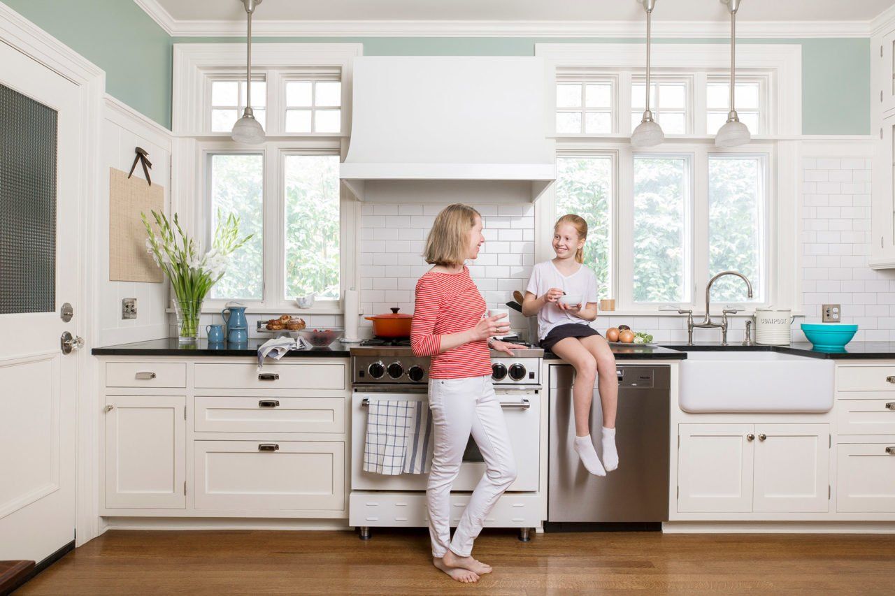 Mother and daughter enjoy their newly remodeled kitchen.