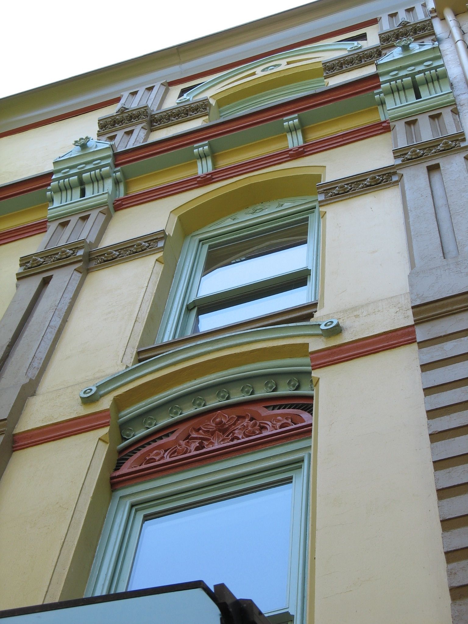 Looking up at a building with a lot of windows