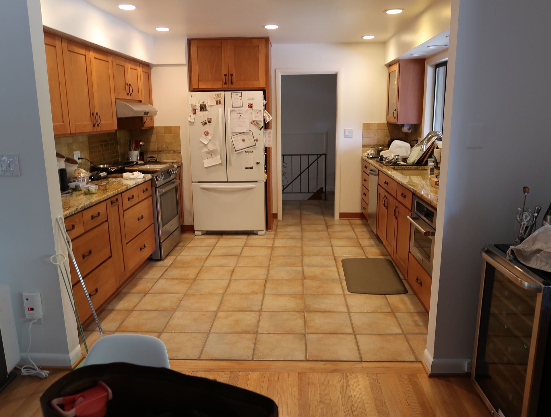 Before and After views of Arciform's remodel of a Mt. Tabor mid-century ranch demonstrate the dramatic effect of removing a wall between the kitchen and living space. 