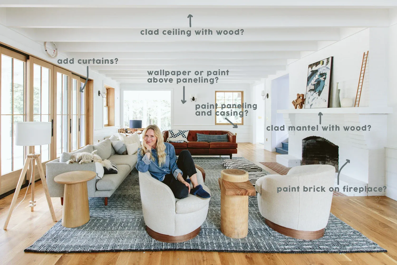 A woman is sitting on a couch in a living room.