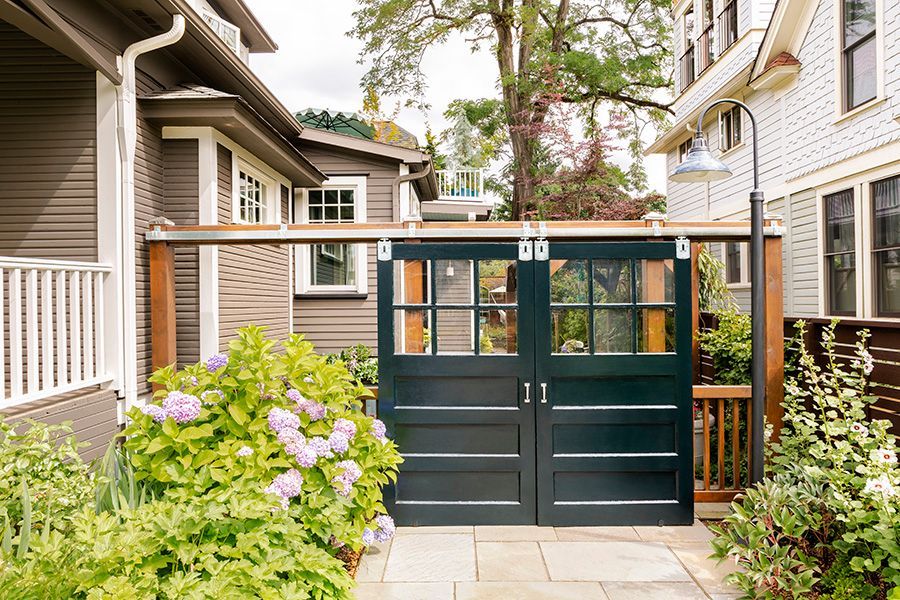 The 2nd floor bath has a roomy shower tiled in ocean hues with a smart under-eave shower bench.