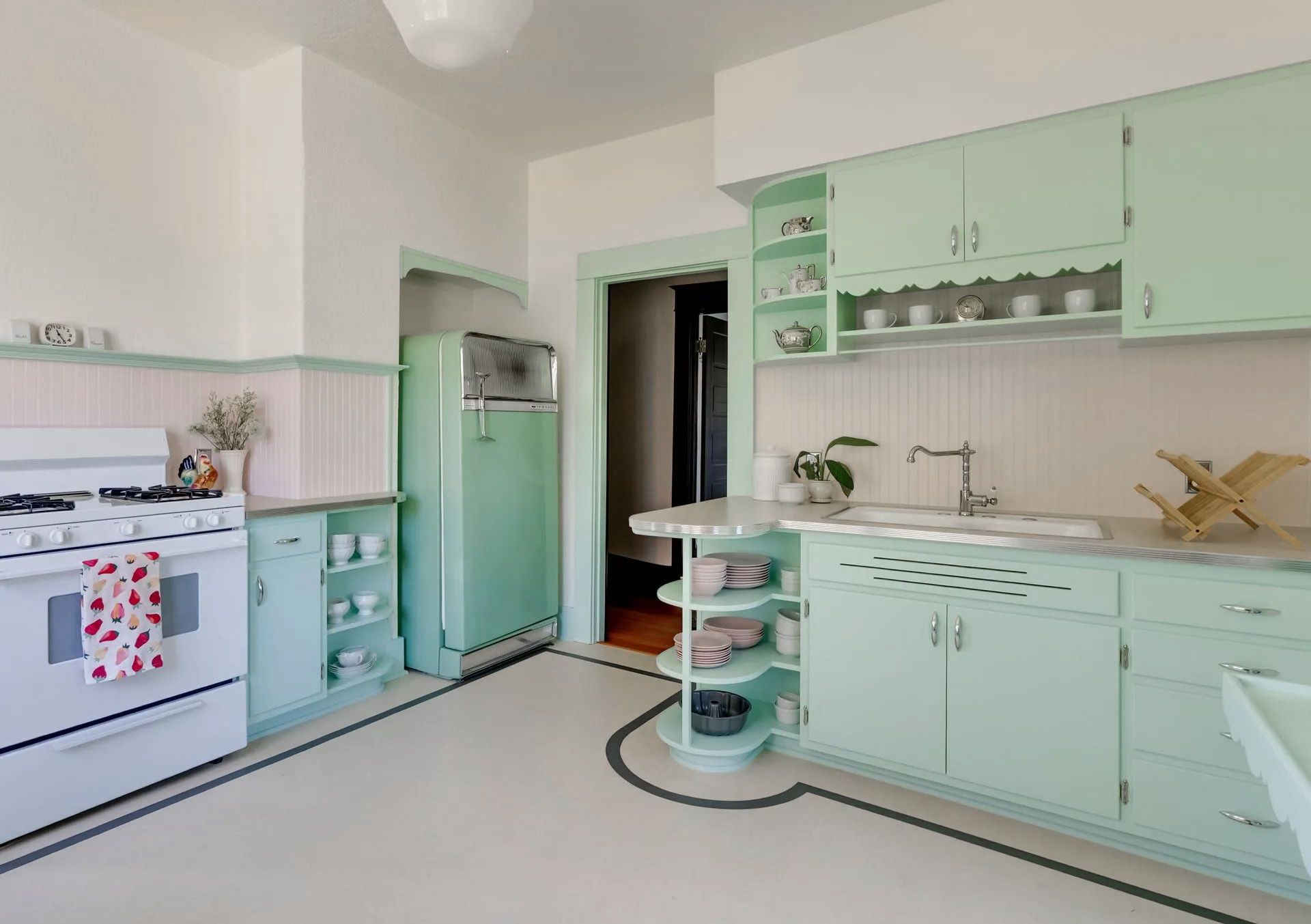 This charming new kitchen in an early 20th century Oregon City bungalow retains the traditional separation from the living and dining spaces.