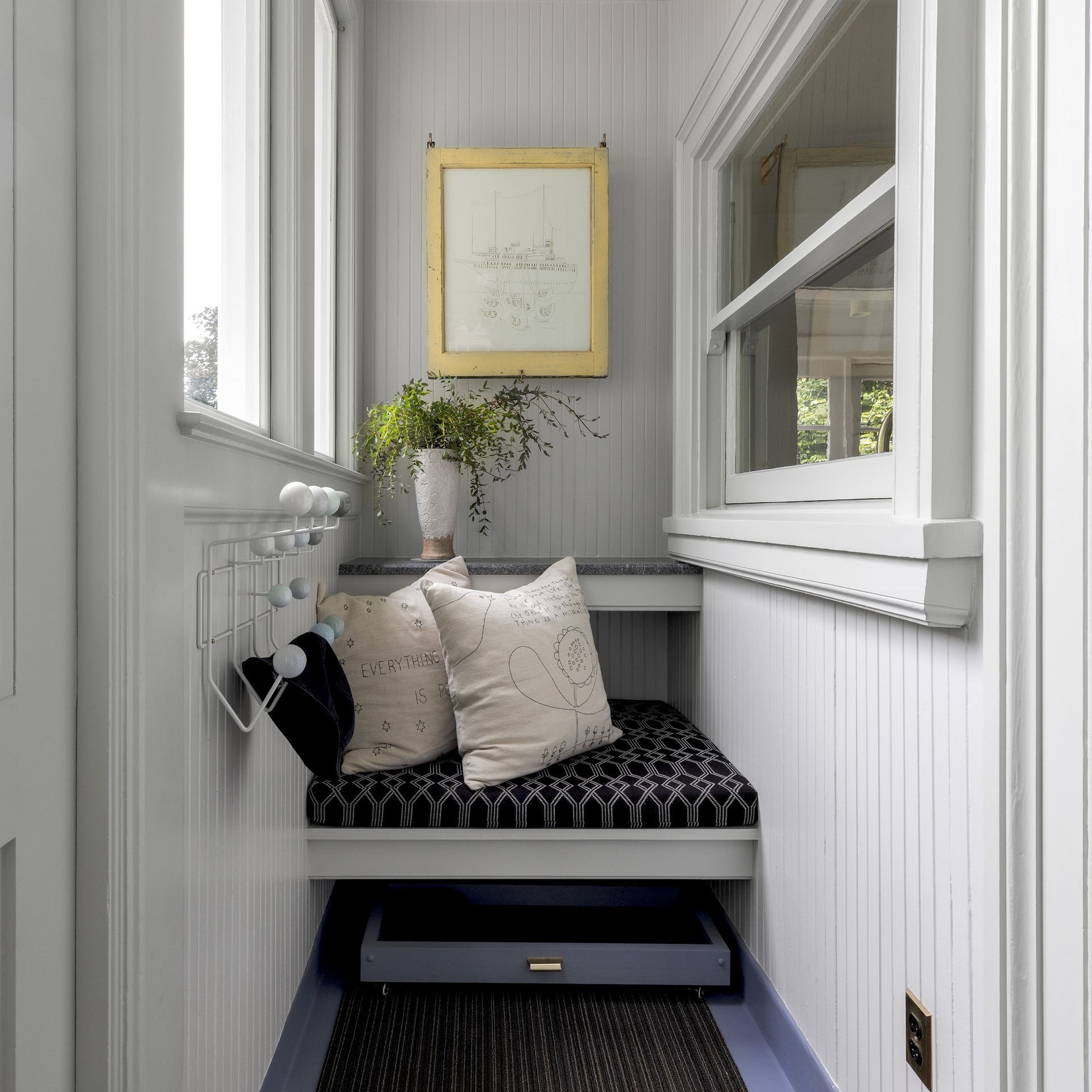 A sweet, petite bench in the rear breezeway is handy for changing muddy shoes