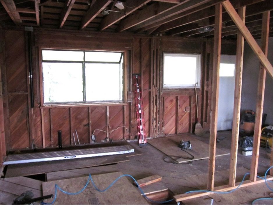 A room with a lot of wooden beams and a window
