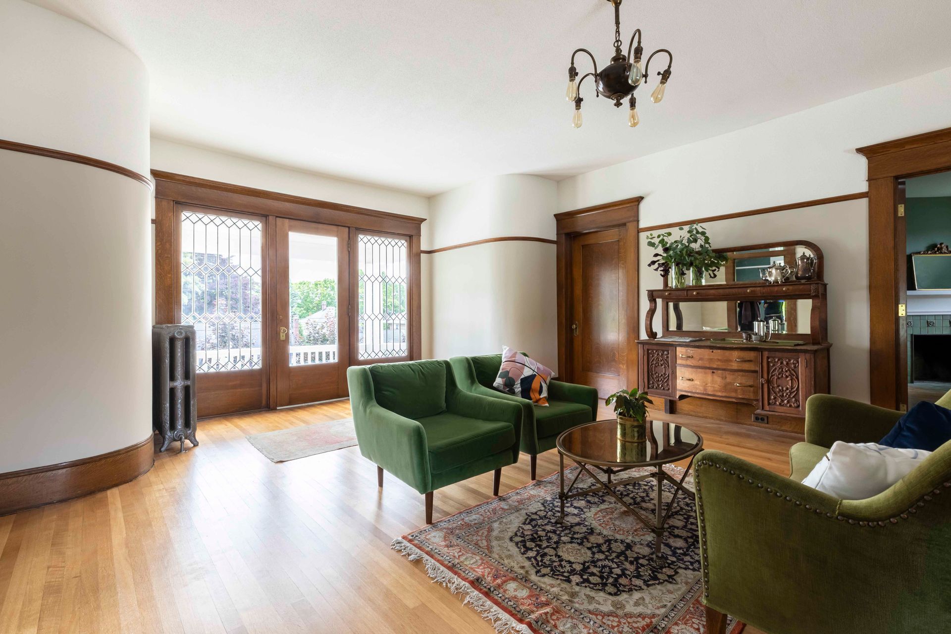 Flooring is reclaimed 100-year-old Fir from a Silverton school. Painted tongue _ groove paneling on the ceiling adds vintage charm.