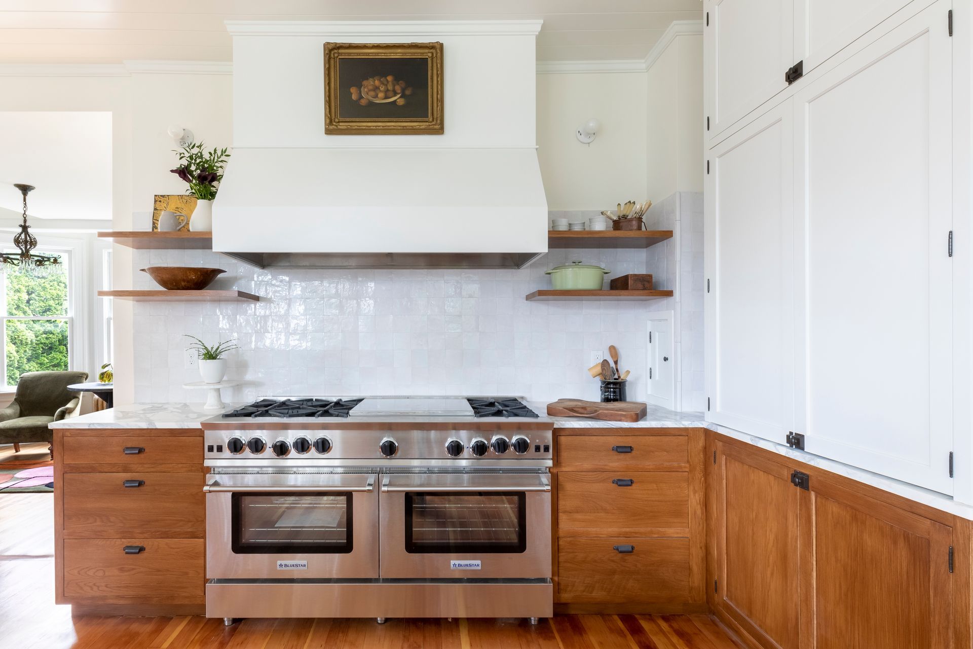 Finishes and fixtures are practical and attractive, from Arciform custom cabinets to Calacatta marble and luminous zellige tile.