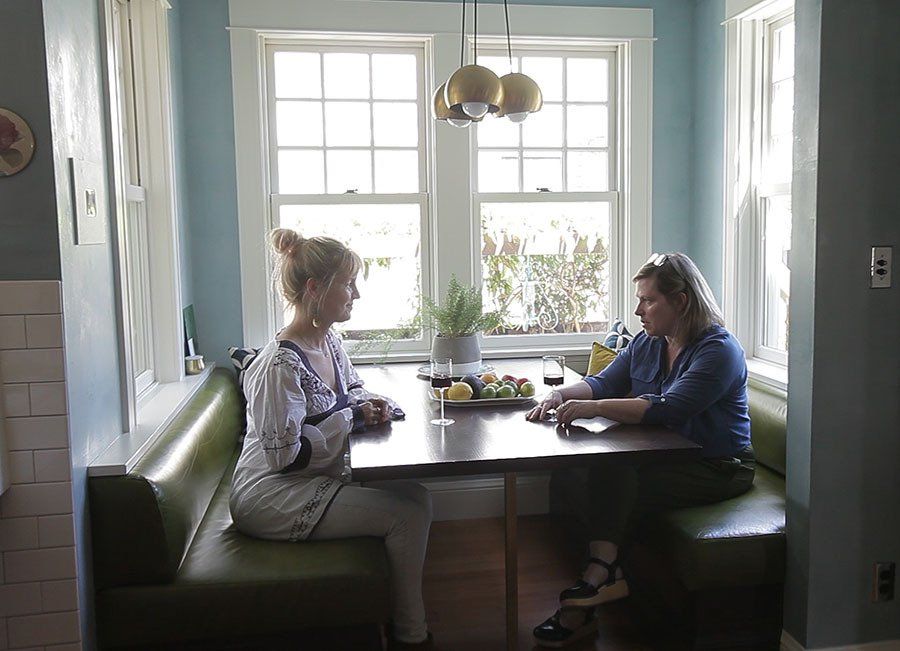 Anne De Wolf and Kerri Hoyt-Pack reminisce in the nook about the 10-year experience of remodeling her home.