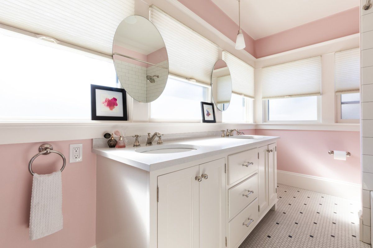 A new bath for the kids is full of natural light and painted a cheery pink.