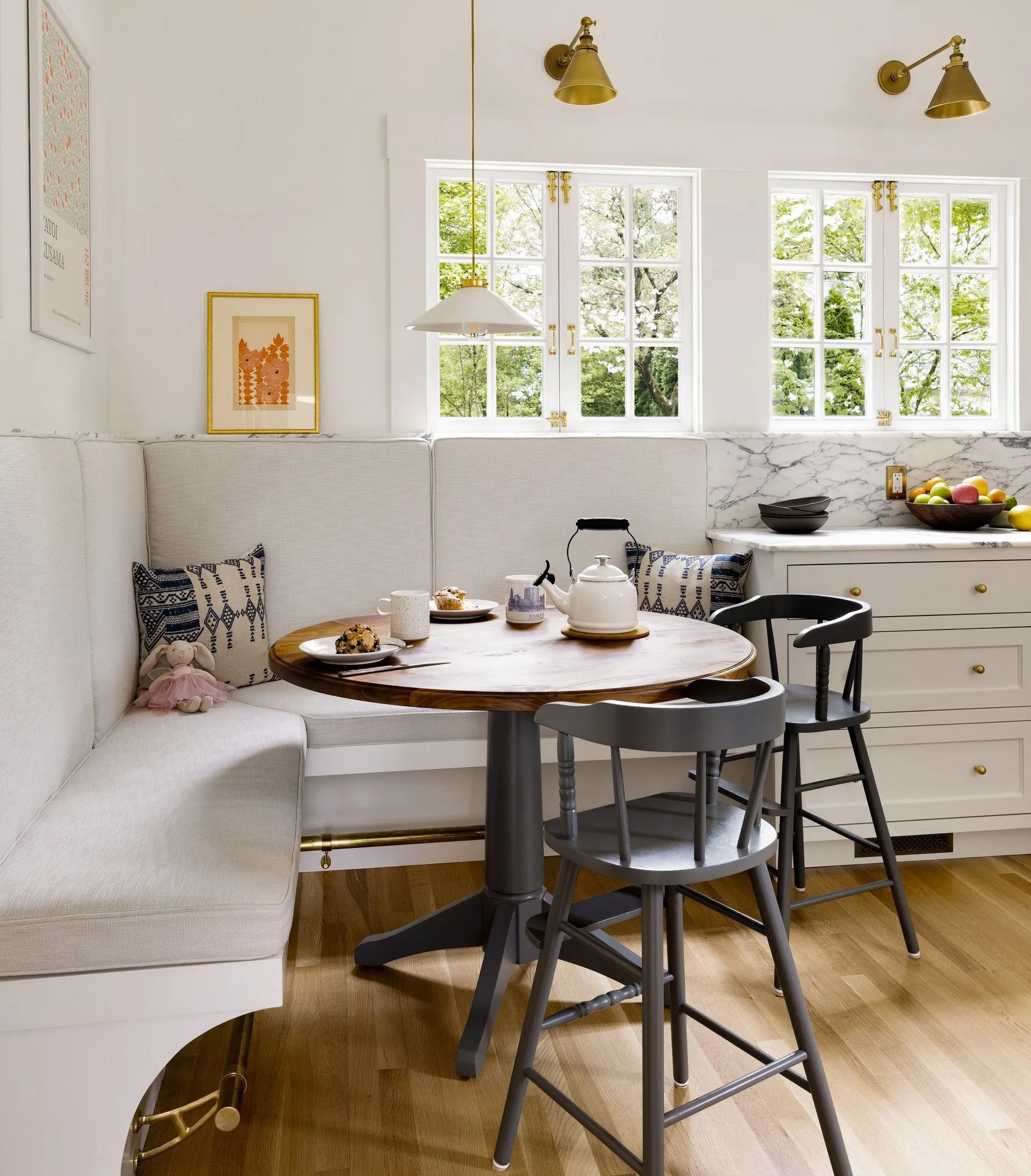 In one corner of the Laurelhurst kitchen shown above, Arciform created a cozy family dining area and built two new windows to match the existing outswing casements. 