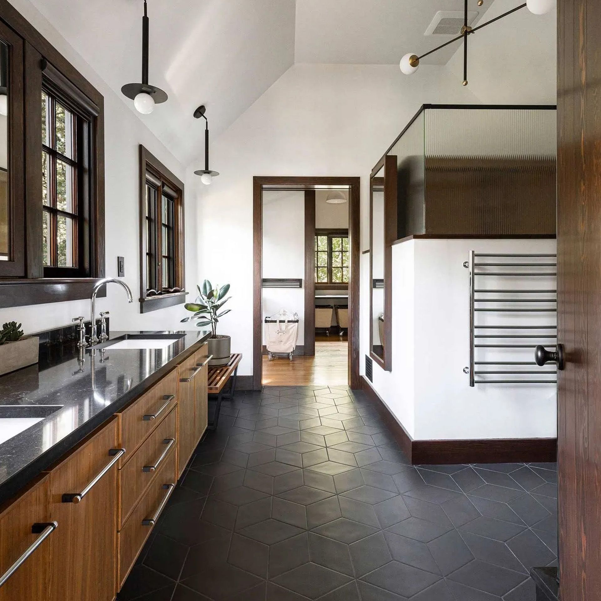 The owners of the historic Edward Dimmit house in the Columbia River Gorge opted for a modern look that respects the materials - dark wood and grey stone - throughout the original house.