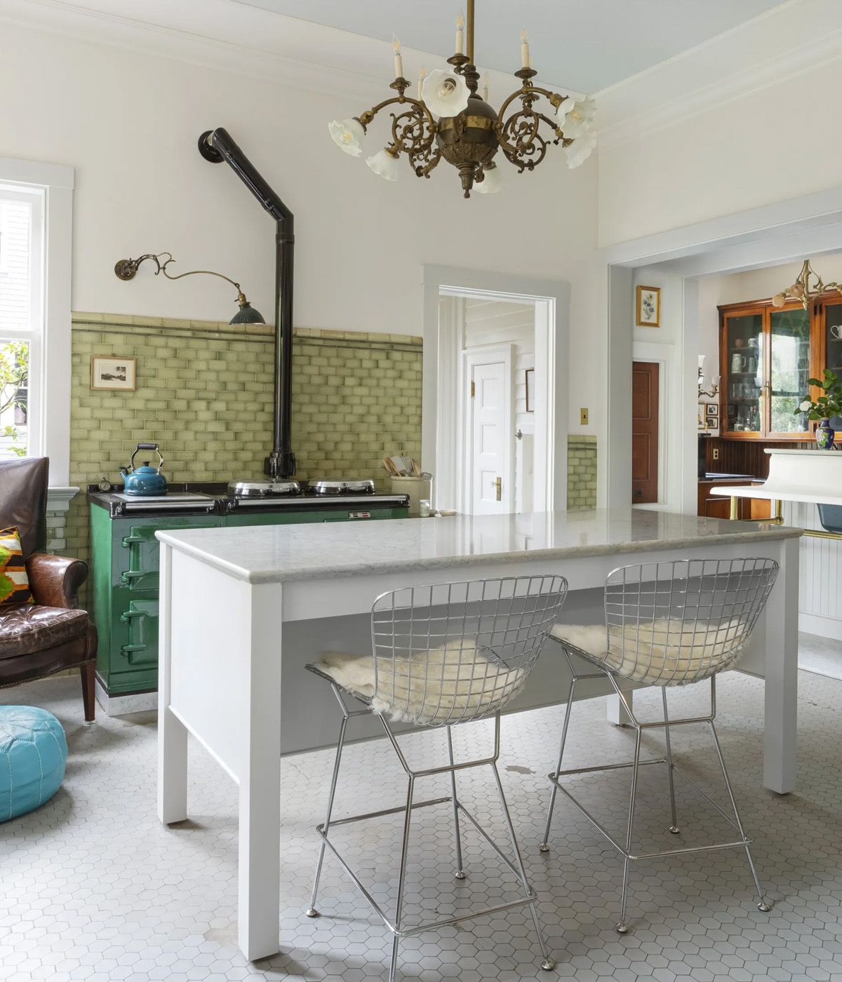 When reimagining their kitchen in the historic Isam White House, Arciform owners Richard and Anne De Wolf anchored the space with a clean-lined, marble-topped island.