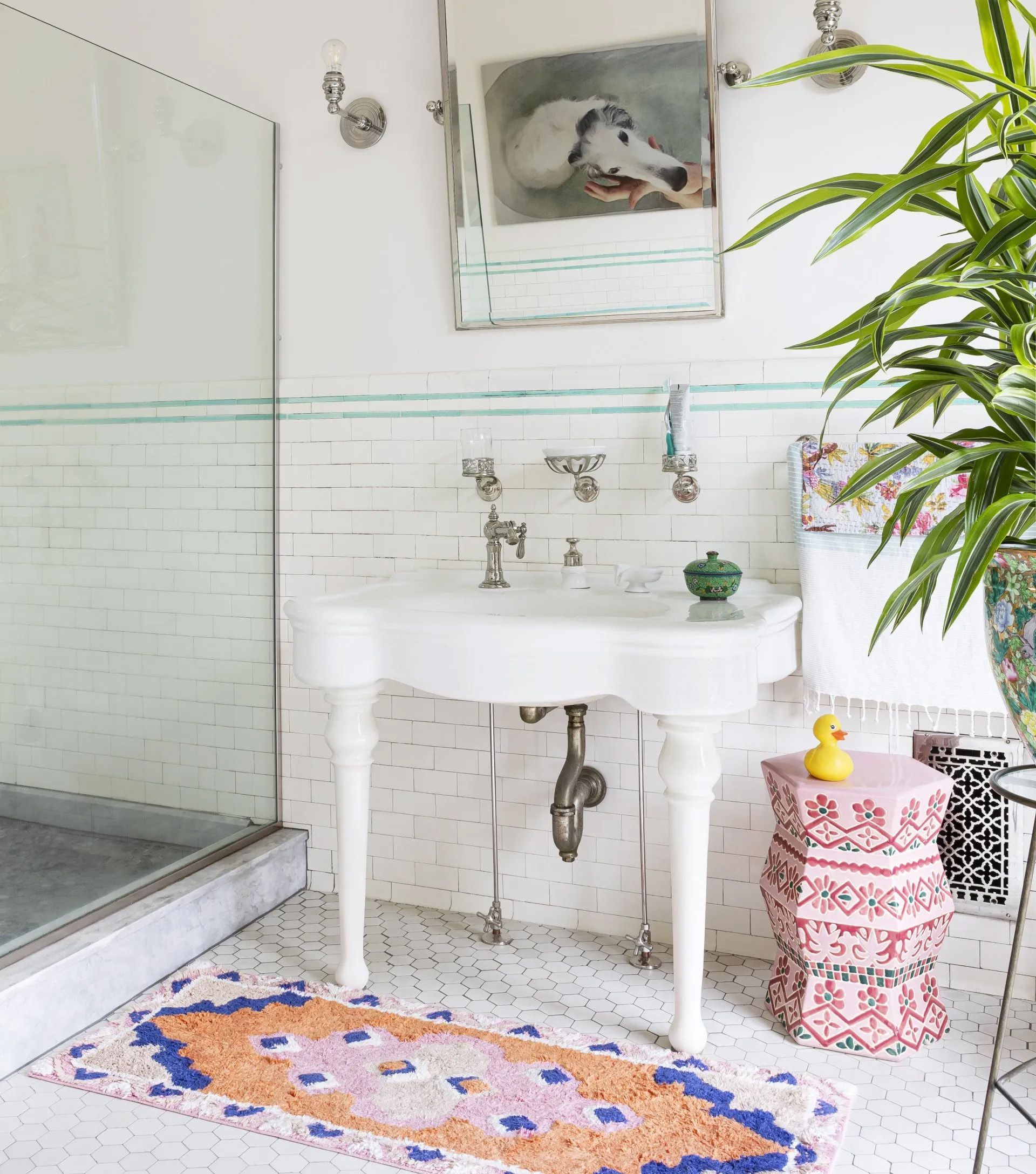 This 1913 bathroom remodel illustrates one approach to bathroom design that is appropriate to Piedmont's vintage homes.  Some original elements were carefully preserved or replicated, while others, such as the mahogany vanity were custom designed to suit the period but also meet the modern need for two sinks and ample storage. 