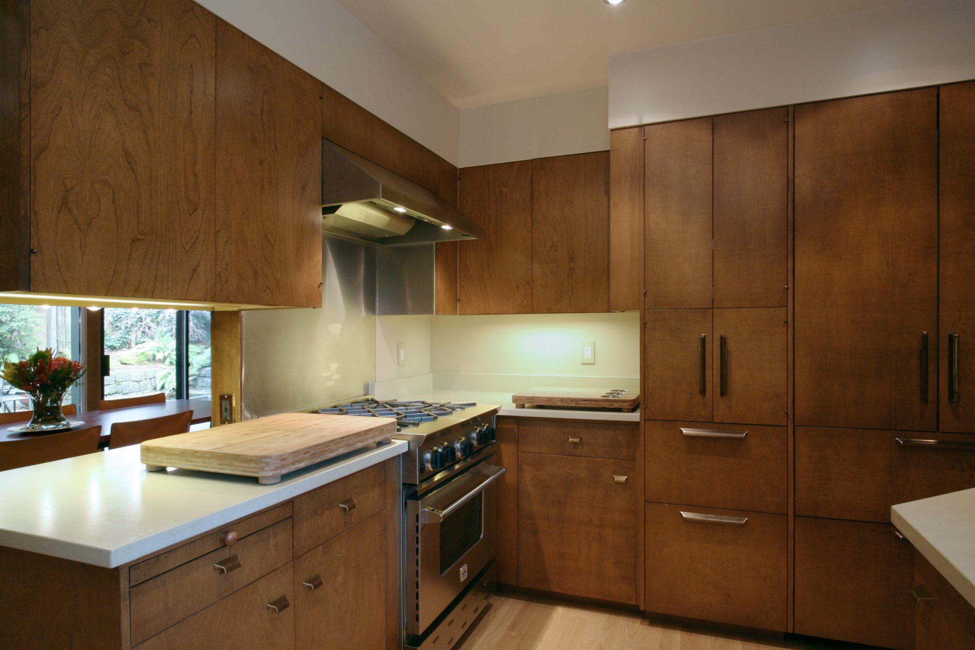 New kitchen cabinets lace into originals with integrated appliances.