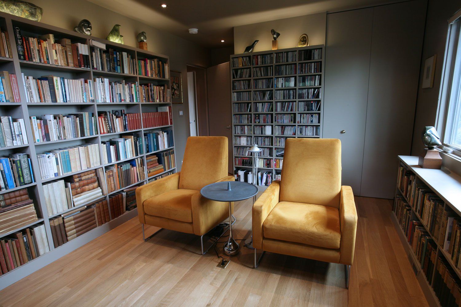 At the front of the house is a bedroom  transformed into a media room and library.