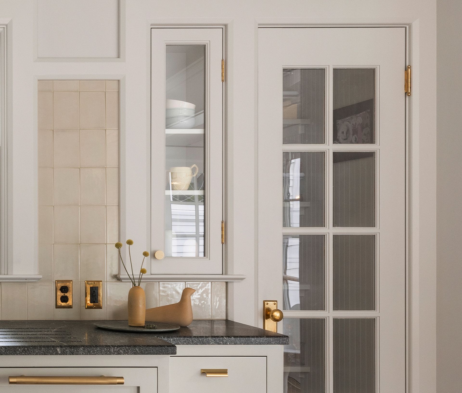 Restored bathroom in 1915 Portland Craftsman home with two pedestal sinks. 