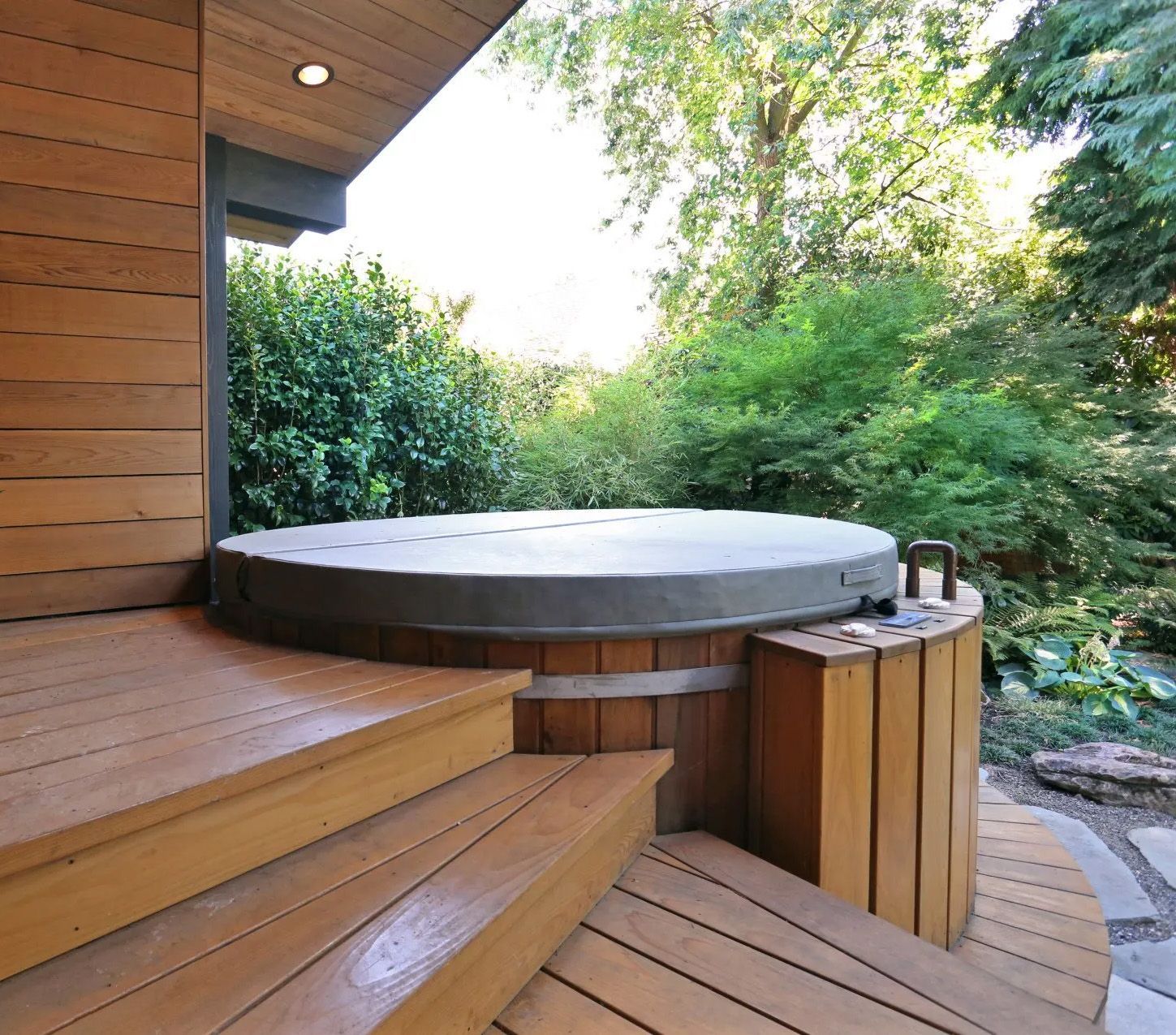 Off the main bedroom is a semi-covered hot tub and deck