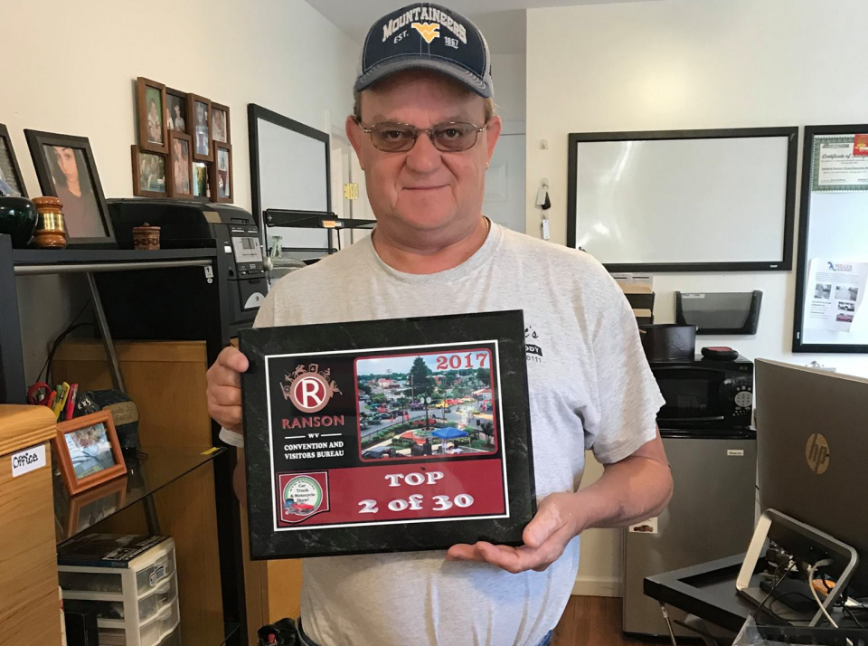 Staff holding frame with Top 2 of 30 in Ranson | Scott's Auto Body