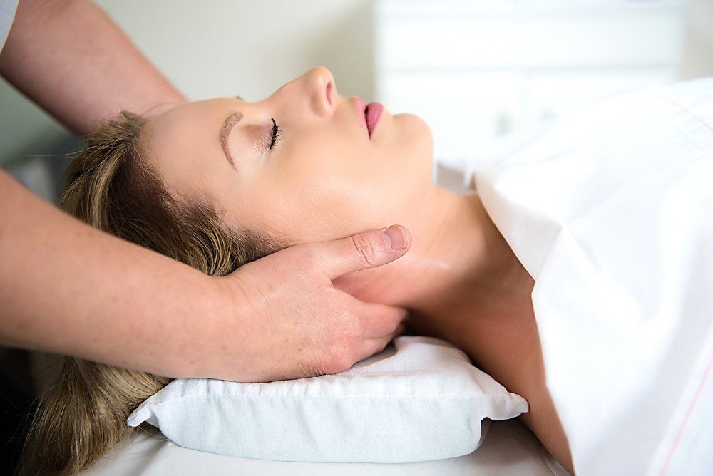 Woman receiving a neck massage. Relax.