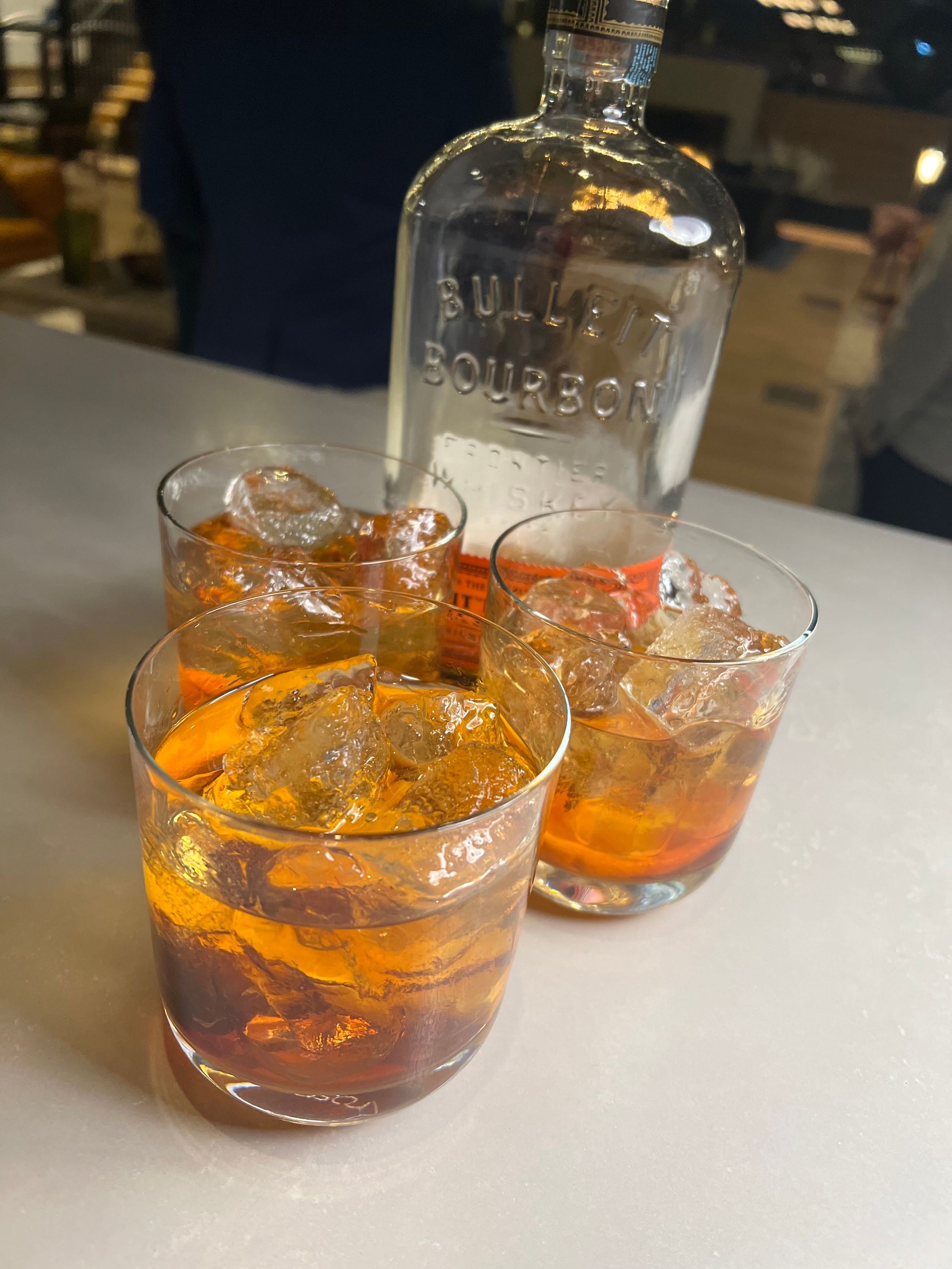 A table with flowers and drinks on it