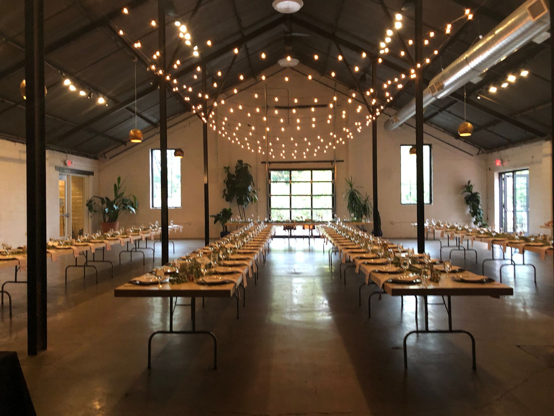 A large room with tables and chairs in it