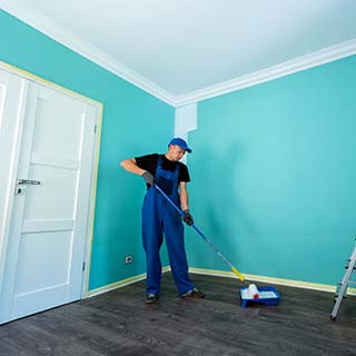 Interior Painting — Worker Painting the Room in Olympia Fields, IL