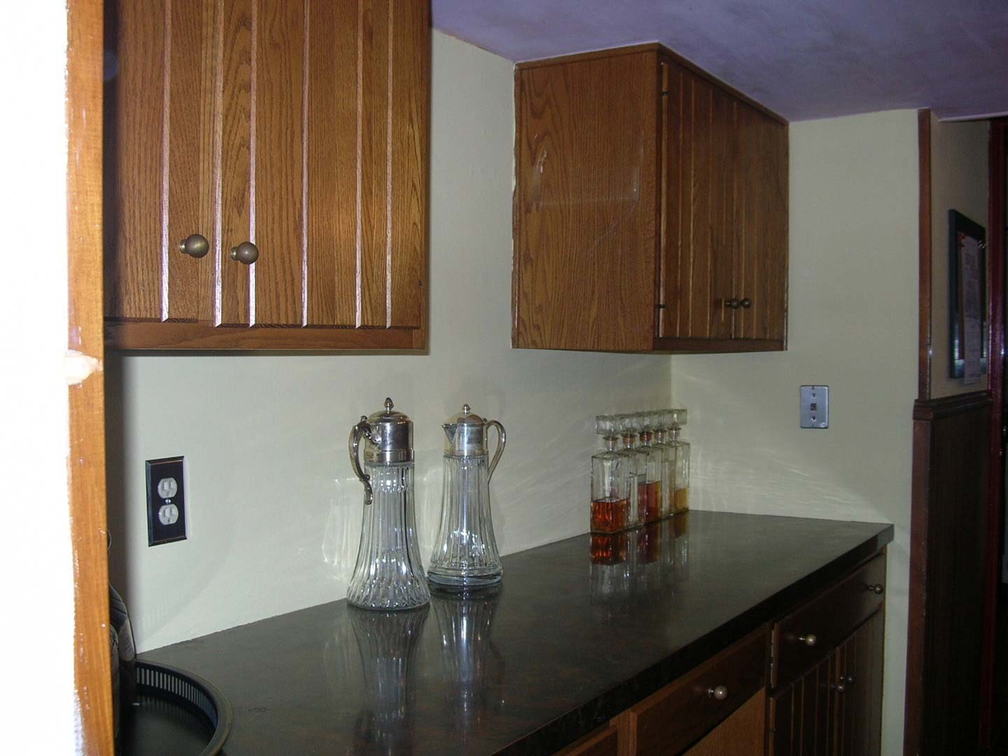 Wooden Cabinets and Dark Counter Top — The Tri-State Area — Carriage House II In-Home Restorations