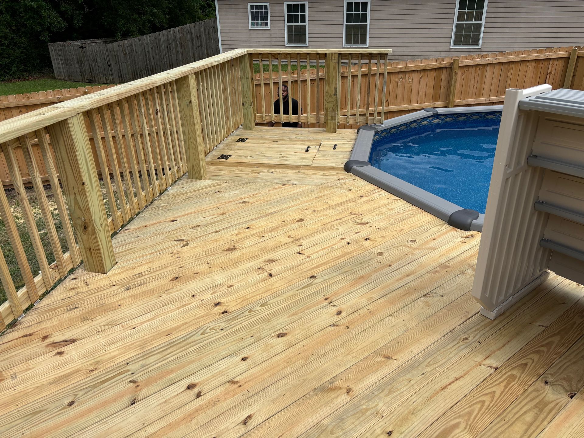 A close up of a wooden wall with a few pieces of wood on it.