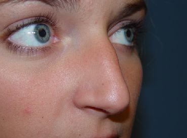 A close up of a woman 's nose and eyes.