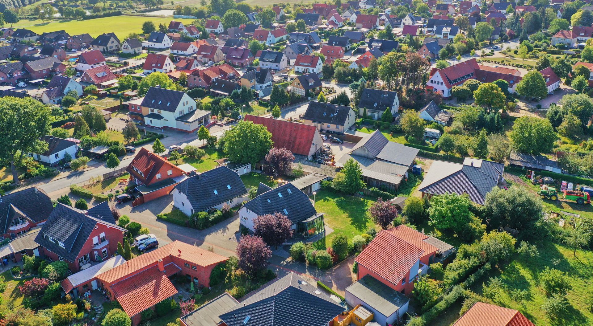 An aerial view of a residential area with lots of houses and trees.