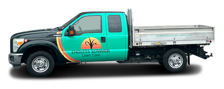 Green and black landscaping truck with logo