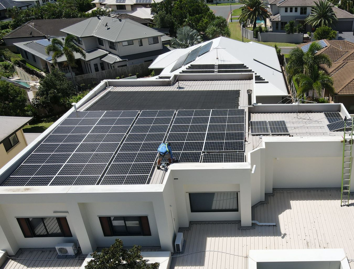 Solar panels in a field, under an overcast sky.