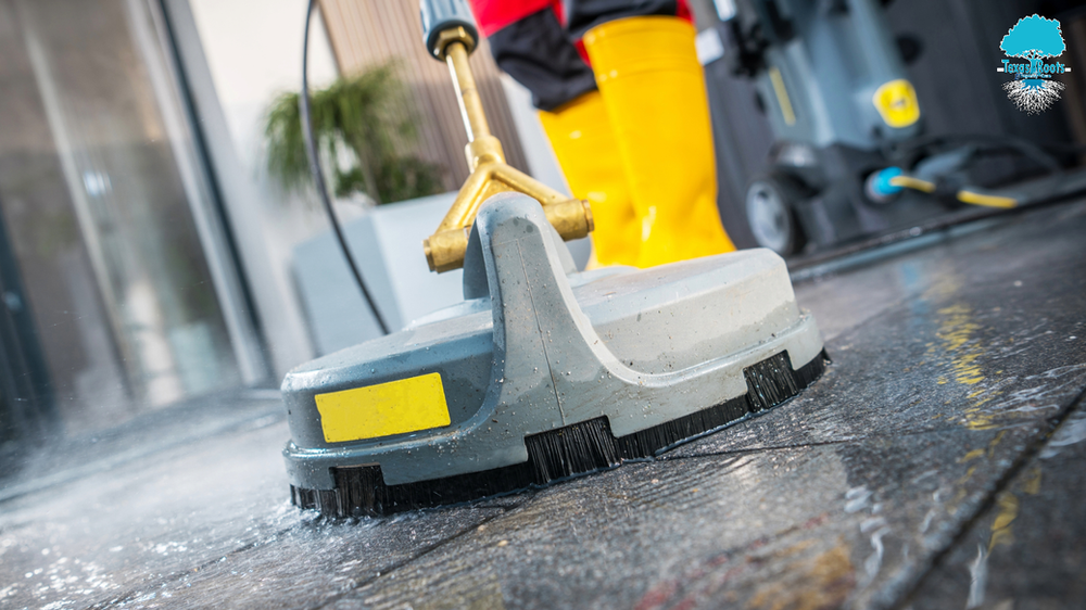Person Wearing Yellow Boots Using Machine to Clean the Floor | Buda, TX | Texas Roots Property Care