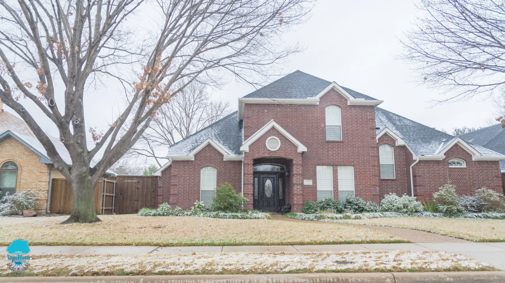 Large Red Brick House with Black Roof | Buda, TX | Texas Roots Property Care