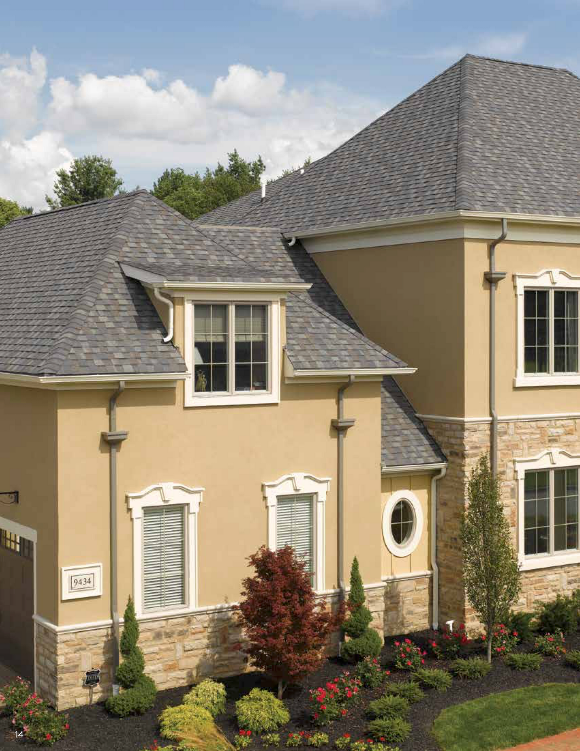 A large house with a gray roof and many windows