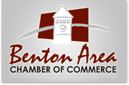 A benton area chamber of commerce logo with a clock tower