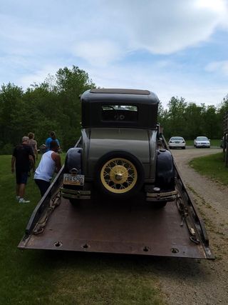 Hot rod automobile being towed by Mark's towing and transport of Buxton Maine