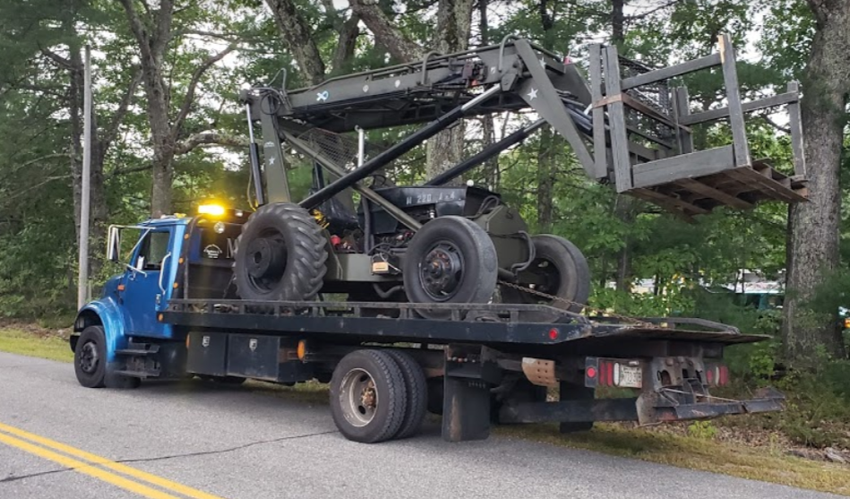 Transporting heavy equipment done by Mark's Towing ans Transport in Buxton Maine