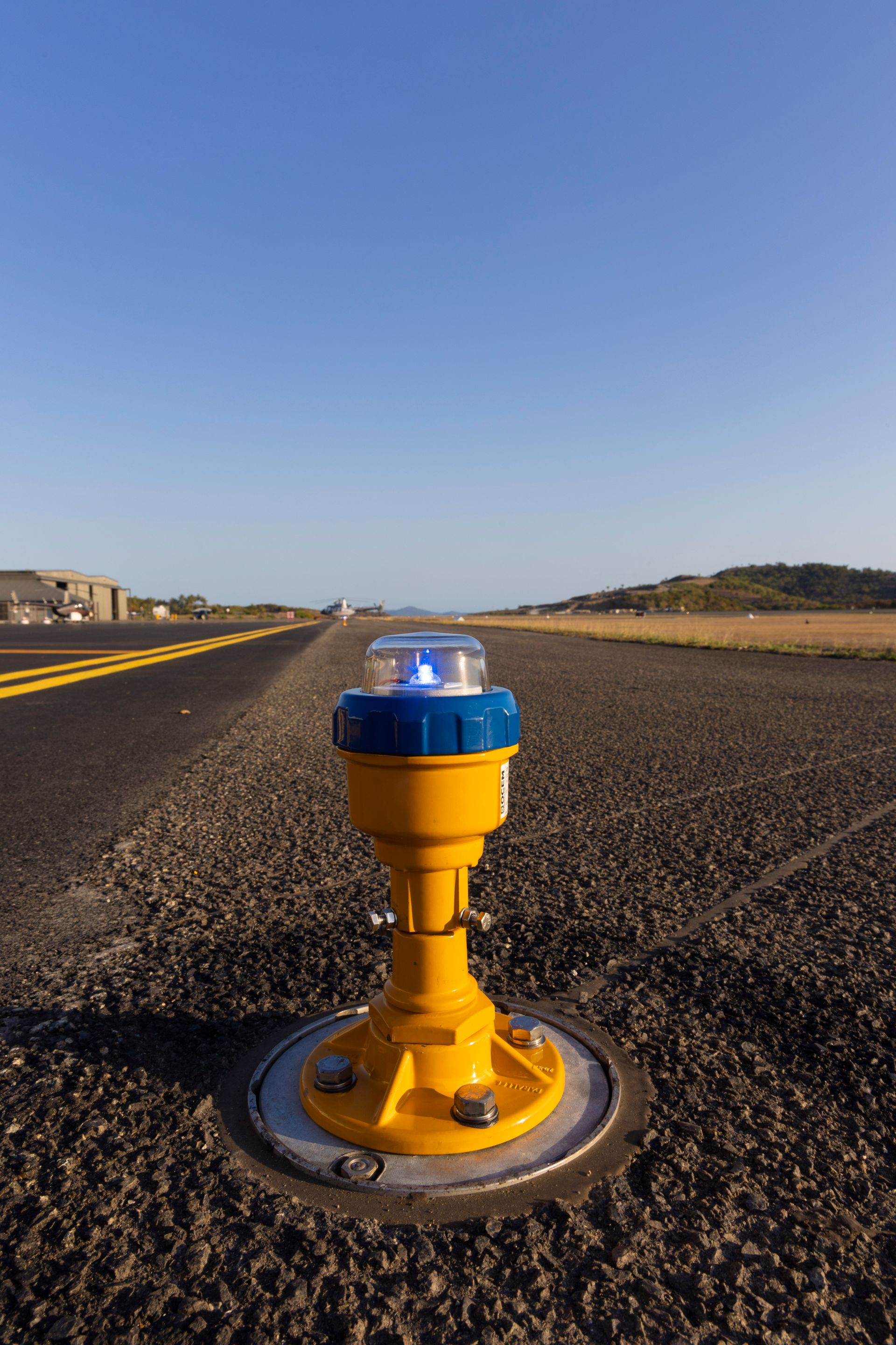 illuminated airfield lighting fixture on taxiway