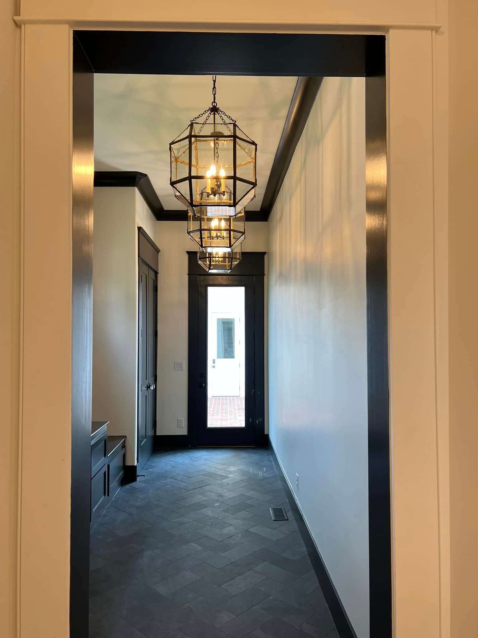 A Hallway With A Chandelier Hanging From The Ceiling — Louisville, KY — Copper Line Electric