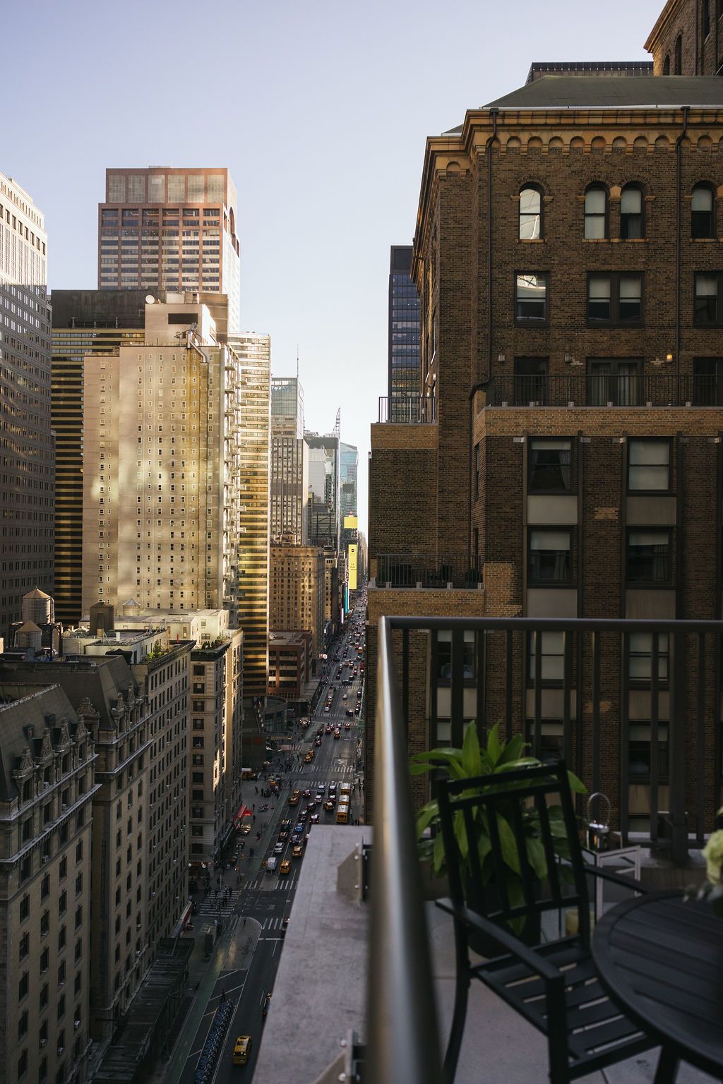 A balcony overlooking a city with lots of tall buildings