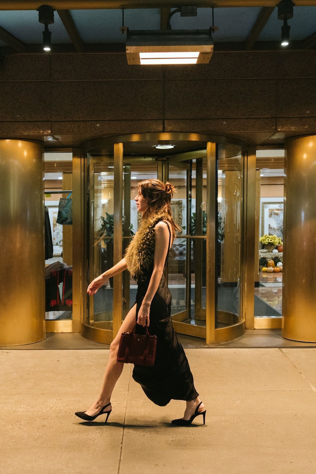 A tall building with a sign theater below.
