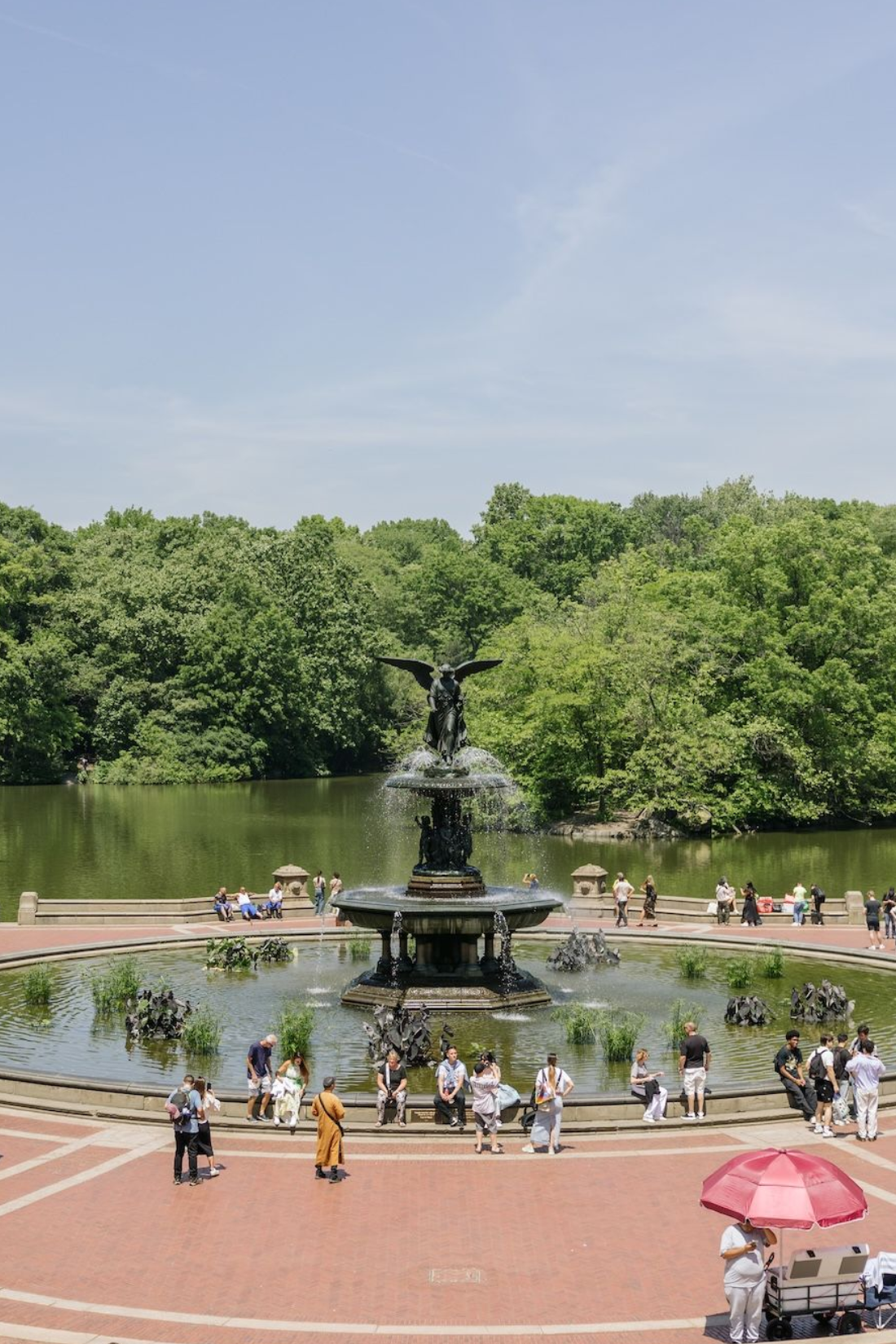 people riding bikes in a park in fall