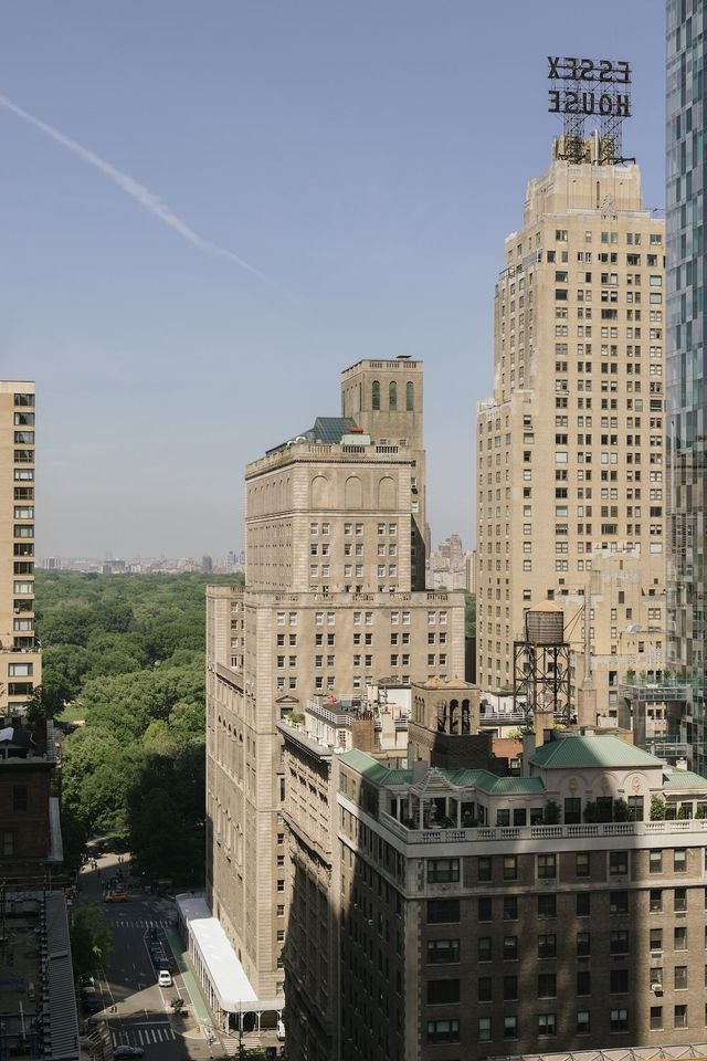 An aerial view of a city with a building that says ' plaza ' on it