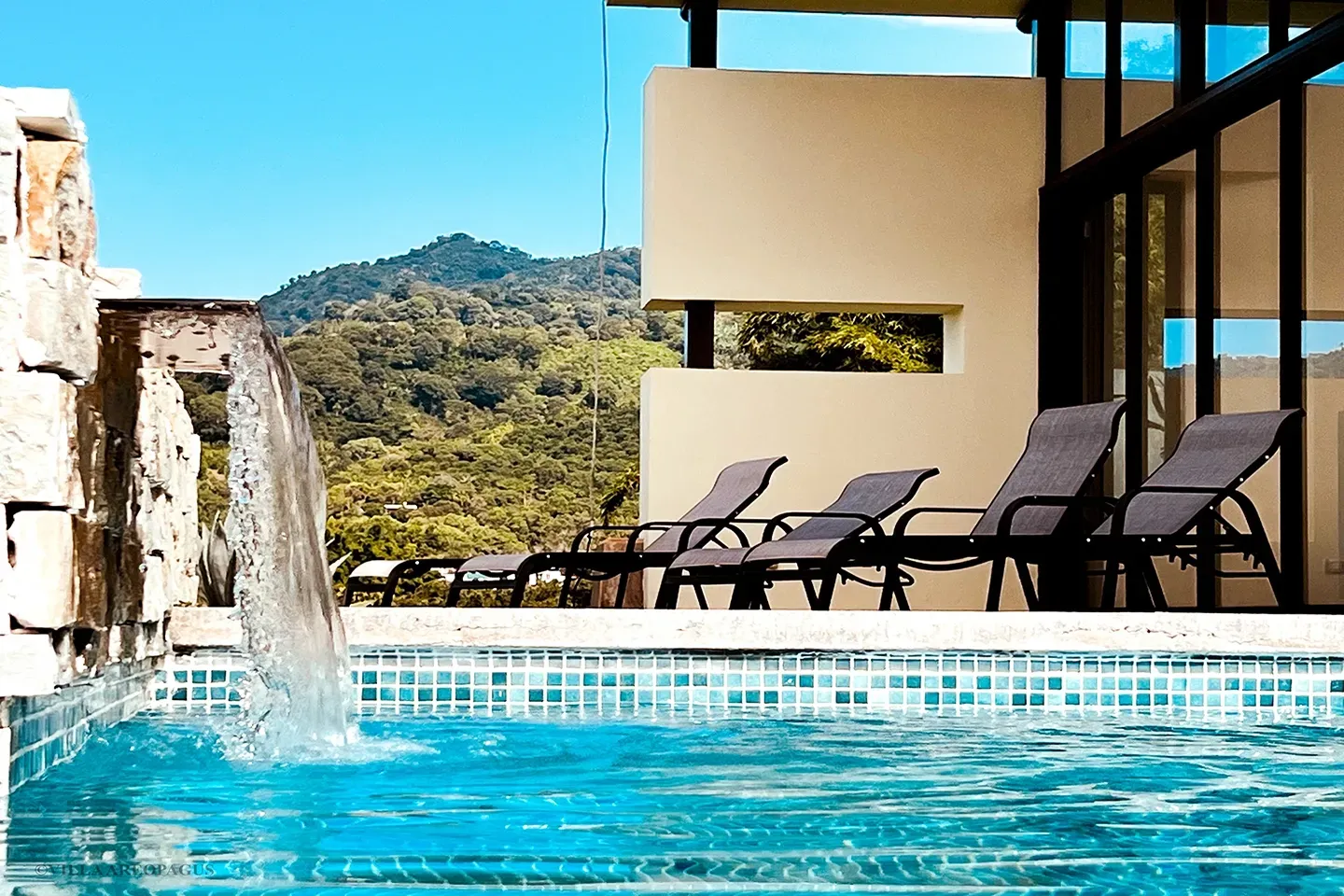 photo pool waterfall lounging Villa Areopagus