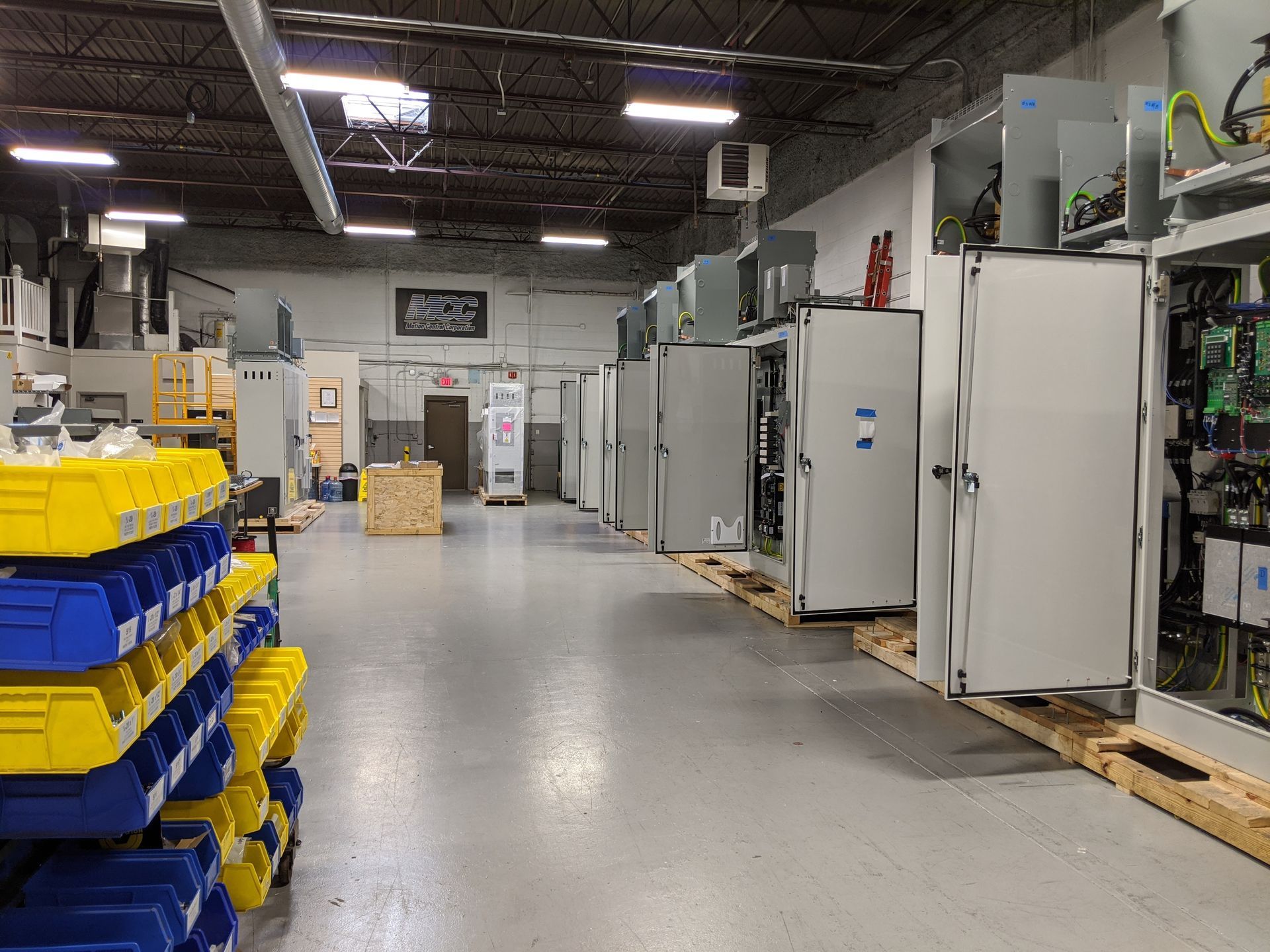 A large warehouse filled with lots of electrical equipment