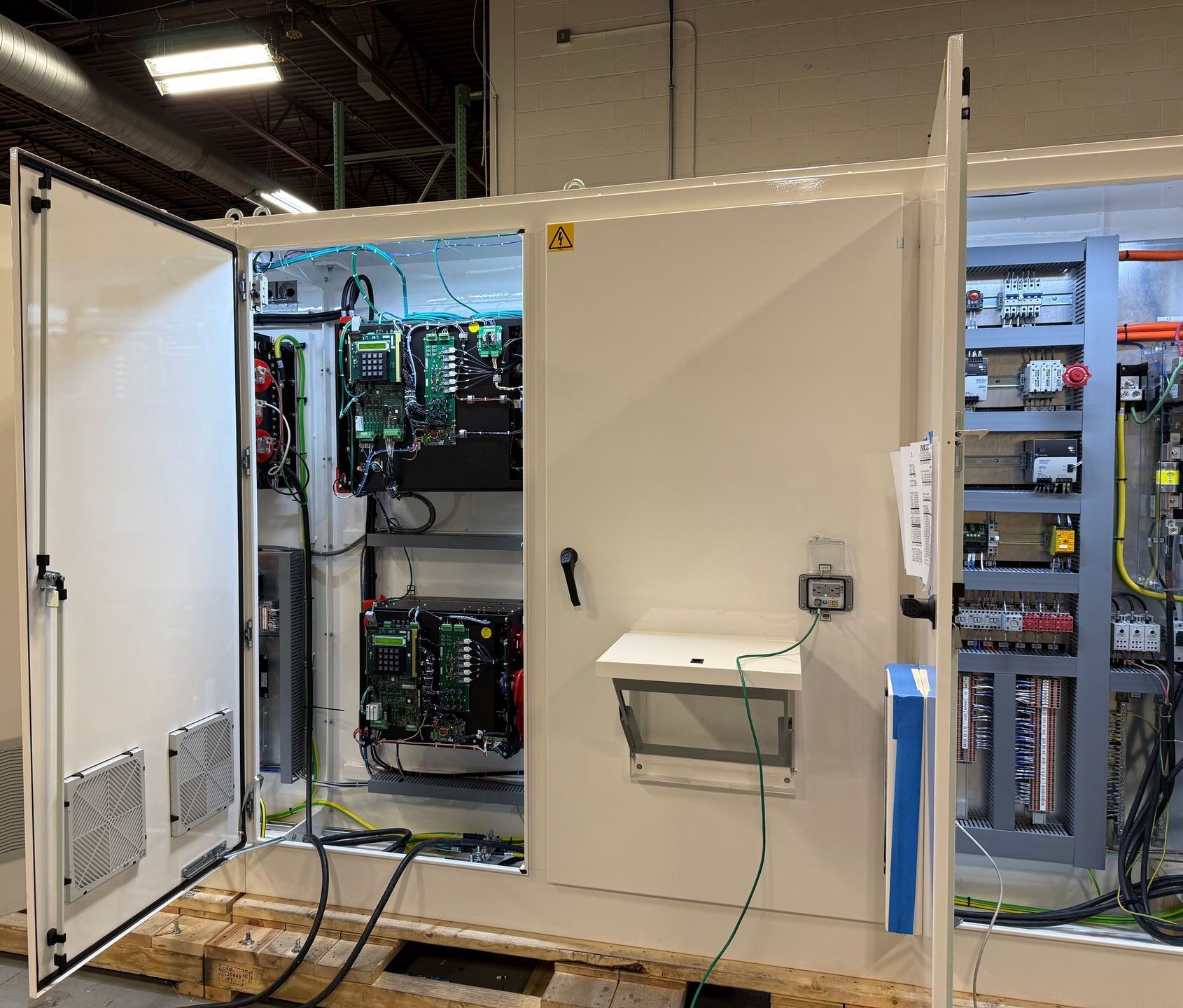 A large white box with a lot of wires coming out of it