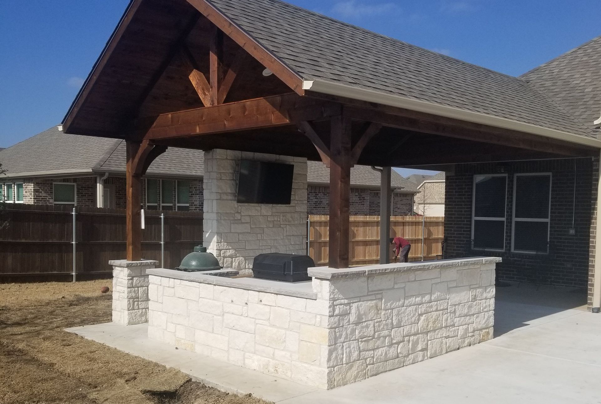 Custom outdoor kitchen with a patio cover