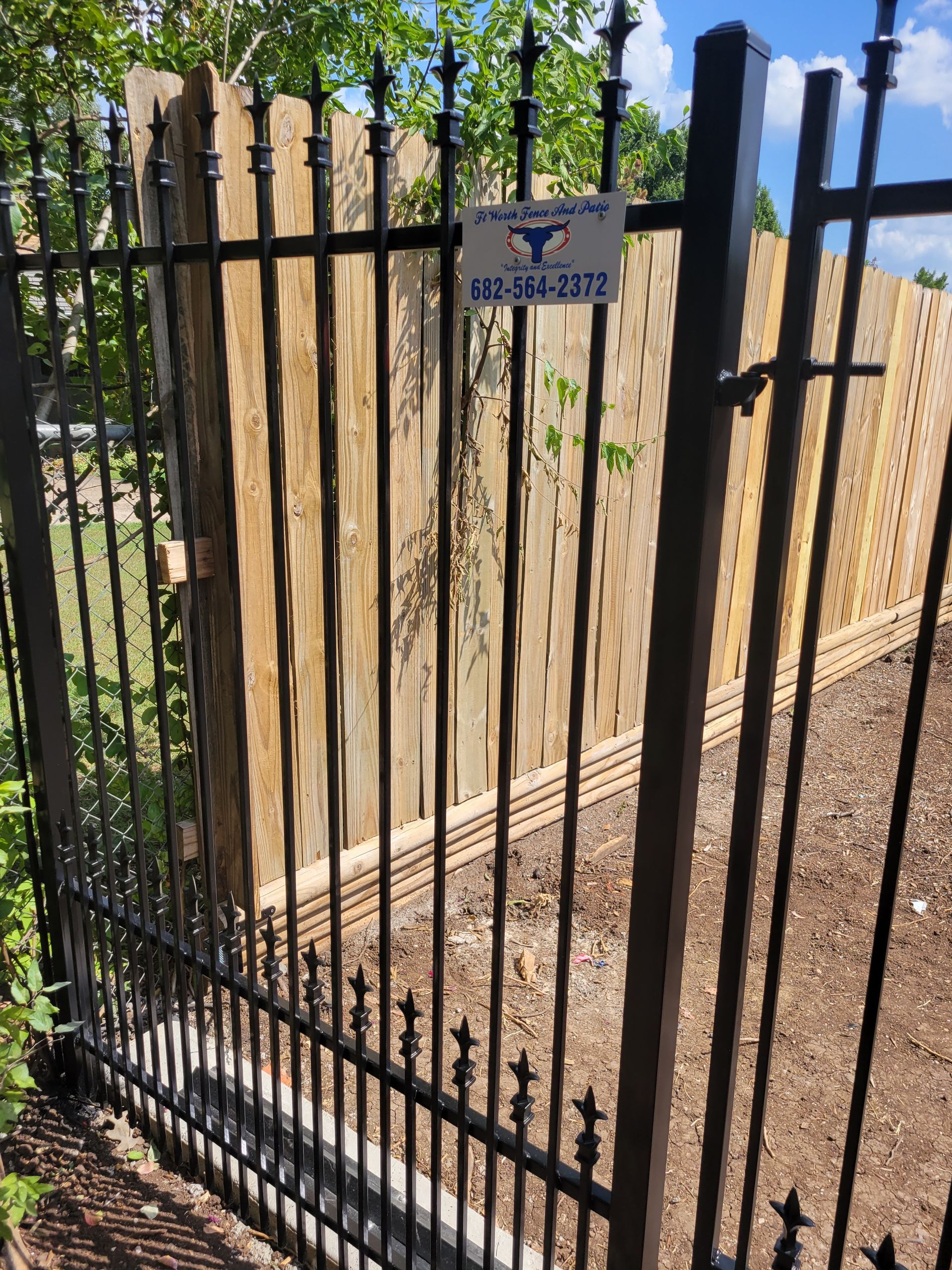Picket style iron fence with puppy bars